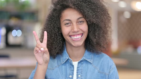 Victory Sign By Excited African Woman