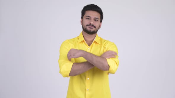 Young Happy Bearded Indian Businessman with Arms Crossed