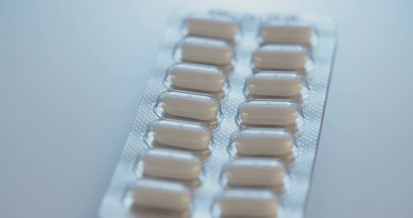 Prescription drugs - Capsules, pills, tablets on reflective background