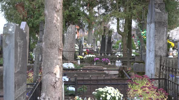 Rural Old Grave Tombstone in Autumn Cemetery