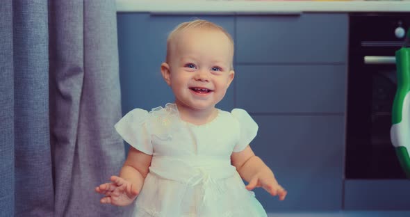 Baby in White Dress Close Up