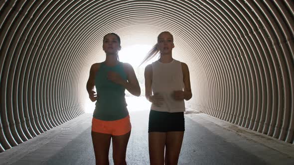 Young Women or Female Friends Running Outdoors