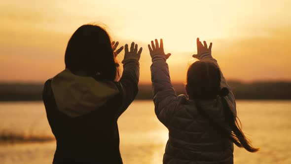 Silhouette of Reaching Helping Hand Hope and Support Each Other Over Sunset