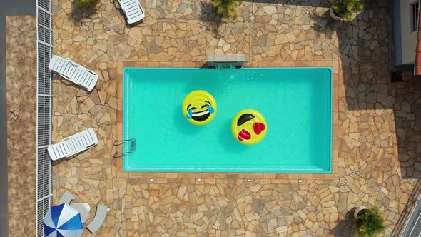 Float smile emoji emoticon icon buoy at swimming pool at countryside