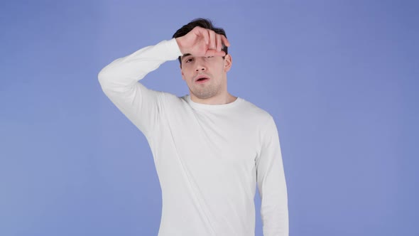 Frustrated European Man Over Purple Wall Background
