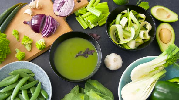 Green Cream Soup in Bowl and Vegetables