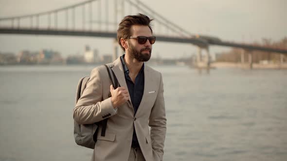 Businessman Relaxing And Walking After Work. Handsome Confident Businessmen In Suit Stroll On City.