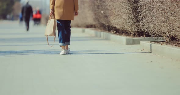 Girl Goes to the Square in Sneakers