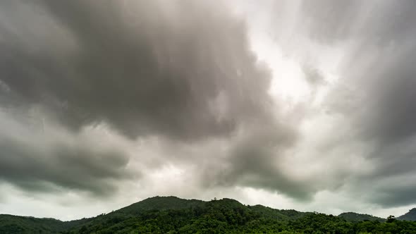 Footage Timelapse Dark sky and black cloud. Black clouds moving fast in Dramatic sky over mountains