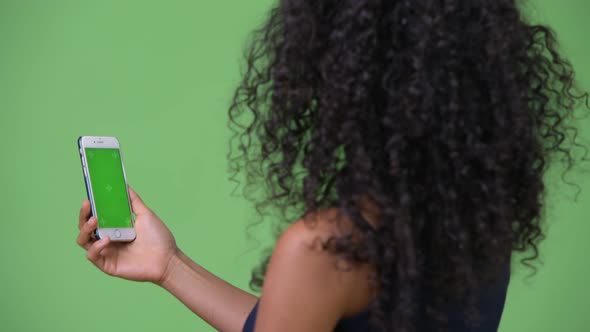 Young Beautiful Hispanic Businesswoman Using Phone