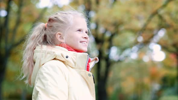 Portrait Little Girl Outdoor in Autumn Orange Park