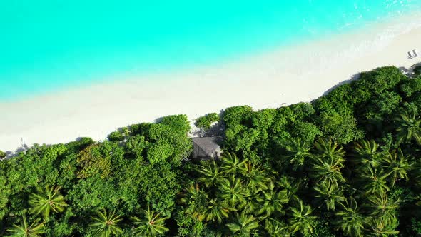 Natural flying abstract shot of a white sandy paradise beach and blue sea background in best quality