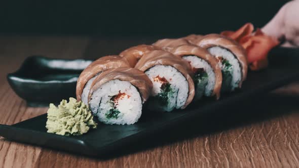 Sushi on a Wooden Table in Restaurant Delicious Japanese Food Sushi Rolls