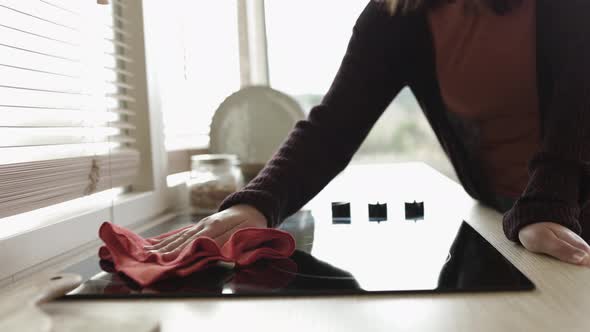 Close Up View of Young Woman Hands Cleaning the Kitchen with Cleaning Cloth