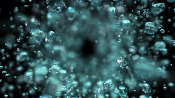 Explosion of Water Droplets Into the Camera in Slow Motion on an Isolated Black Background. alt