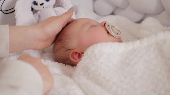 Mom Rocks Baby in Bed Puts Her to Sleep Soothes