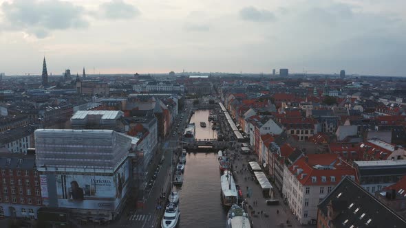 Famous Nyhavn Pier with Colorful Buildings and Boats in Copenhagen Denmark
