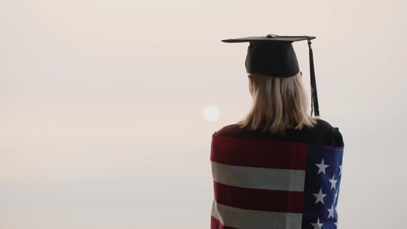 Rear View of a Graduate with the Flag of USA
