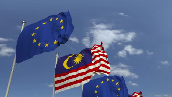 Flags of Malaysia and the European Union Against Blue Sky