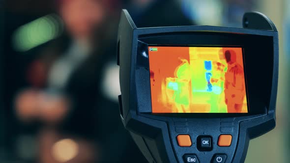 Screen of a Thermographic Camera Showing People's Thermal Image