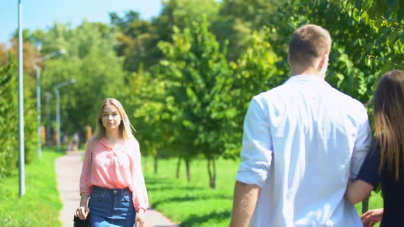 Guy Staring at Passing Blonde Walking Along Park With His Girlfriend, Lovelace