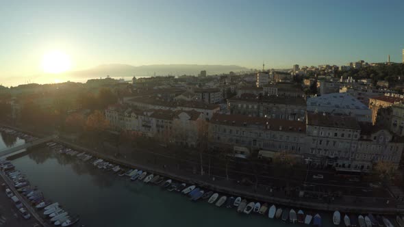 Aerial view of rooftops and anchored boats