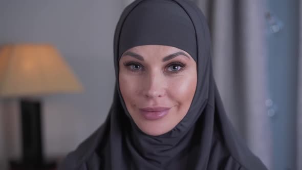 Close-up Portrait of Modern-looking Woman with Grey Eyes in Hijab