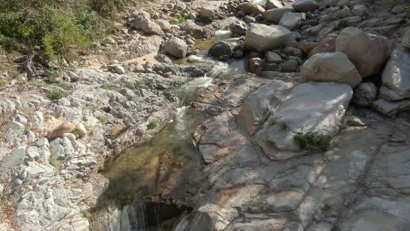 Large Stones And Creek At Yelapa Waterfall On Rainforest In Jalisco, Mexico. Pullback