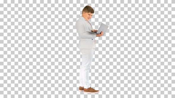 Caucasian boy in a suit working on laptop, Alpha Channel