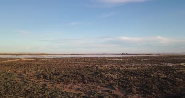 Lake Tyrrell Australia, drone flying over bushland towards the salt lake