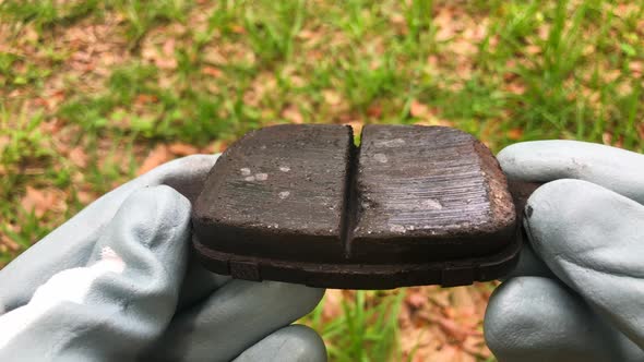 Glazed brake pad. Safety issue concern. Bad smoking failed car brake pads.