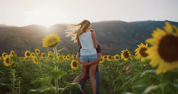 Happy couple in sunflower fields