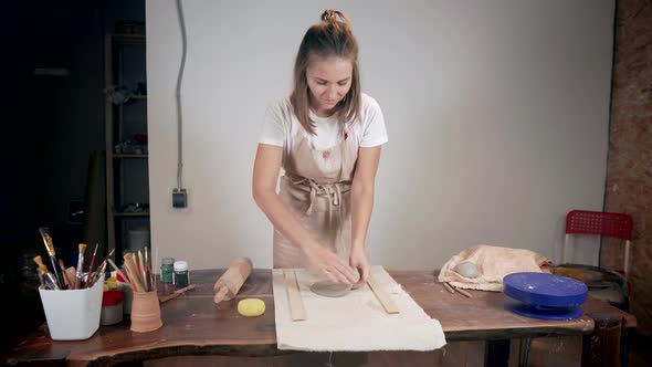 Blonde Woman Working with Clay in Her Workshop