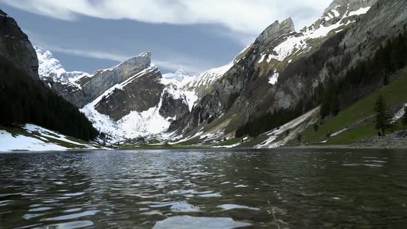 Snow Capped Mountains In The Alps Of Switzerland On The Lake Seealpsee.