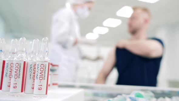 Coronavirus Vaccines and a Man Getting Injected with One Dose