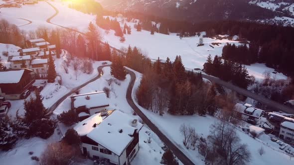 swiss village in winter from drone view