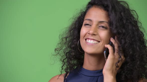 Young Beautiful Hispanic Businesswoman Talking on the Phone