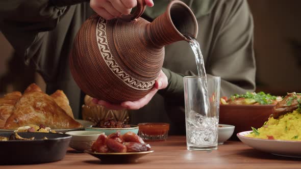 Pouring Water Muslim Family Dinner Ramadan Iftar