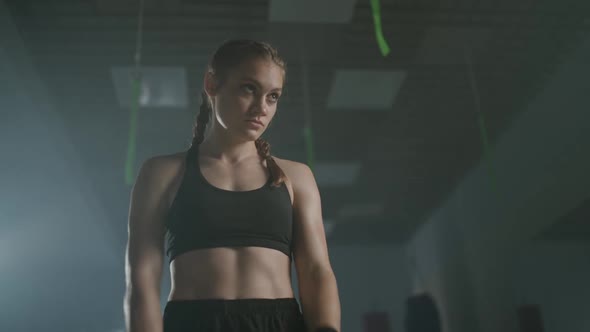 Professional Female Fighter Warms Up Before a Fight in the Boxing Gym  Slow Motion