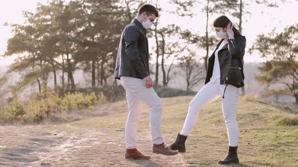 Couple Is Dancing Together Hitting Their Feet Outside