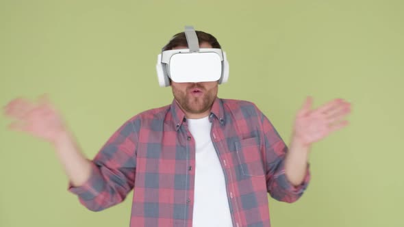 An Adult Man in Vr Glasses with 3D Virtual Reality He is Having Fun and Dancing