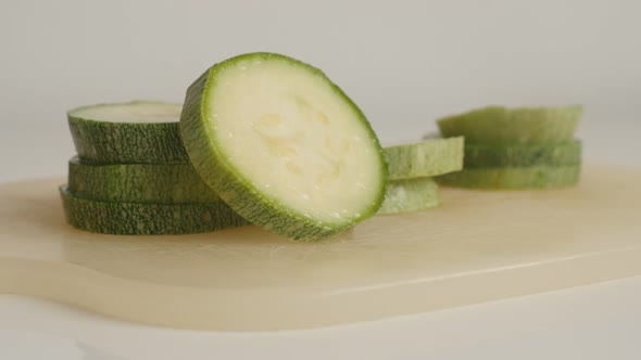 Healthy zucchini on pile close-up 4K 2160p 30fps UltraHD tilting  footage - Slices of Pepo cylindric