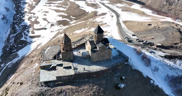 Aerial view of Gergeti Trinity Church, Tsminda Sameba in Kazbegi. Georgia 2022