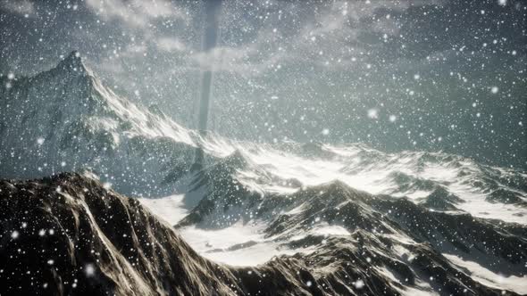 Heavy Snowing Focused on the Snowflakes Mountains in the Background