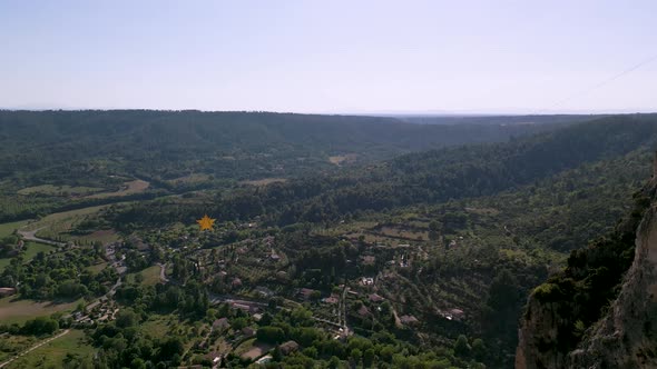 Golden star hanging between cliffs in Moustiers-Sainte-Marie village, France