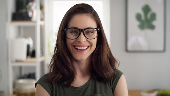 Close up video portrait of happy woman with eyeglasses. Shot with RED helium camera in 8K.