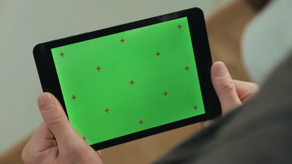 Male Finger Typing on Tablet Green Screen. Man Texting on Tablet Chroma Key