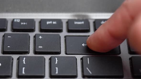 Backspace Button Pressing on Keyboard Laptop Keyboard Close Up