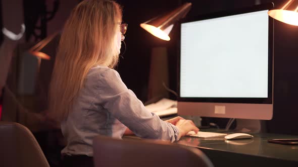 Businesswoman Work On Workplace At Night.Woman Working In Office Late Night.