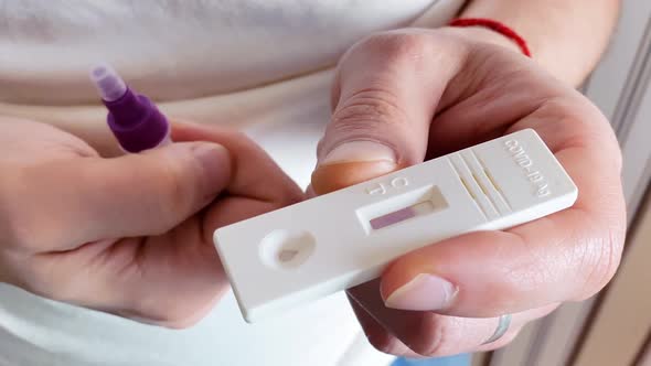 Caucasian Man Doing an Antigen Test for Coronavirus